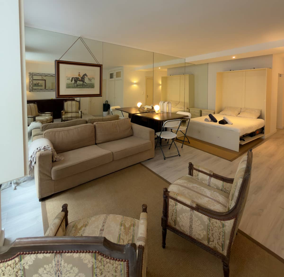 Original dim phone photo of the same studio apartment